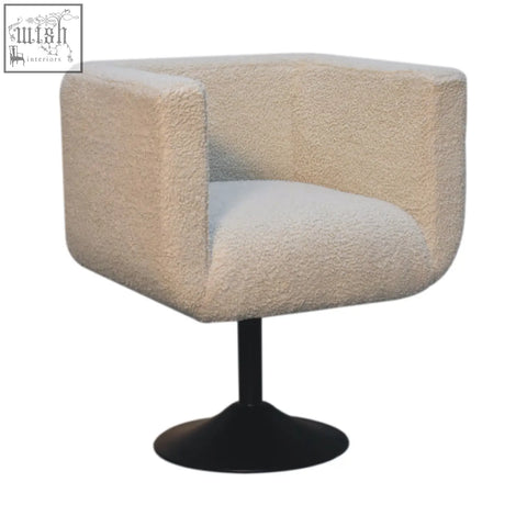 Cream boucle swivel chair with plush texture and black pedestal base from artisan furniture solid mango wood collection