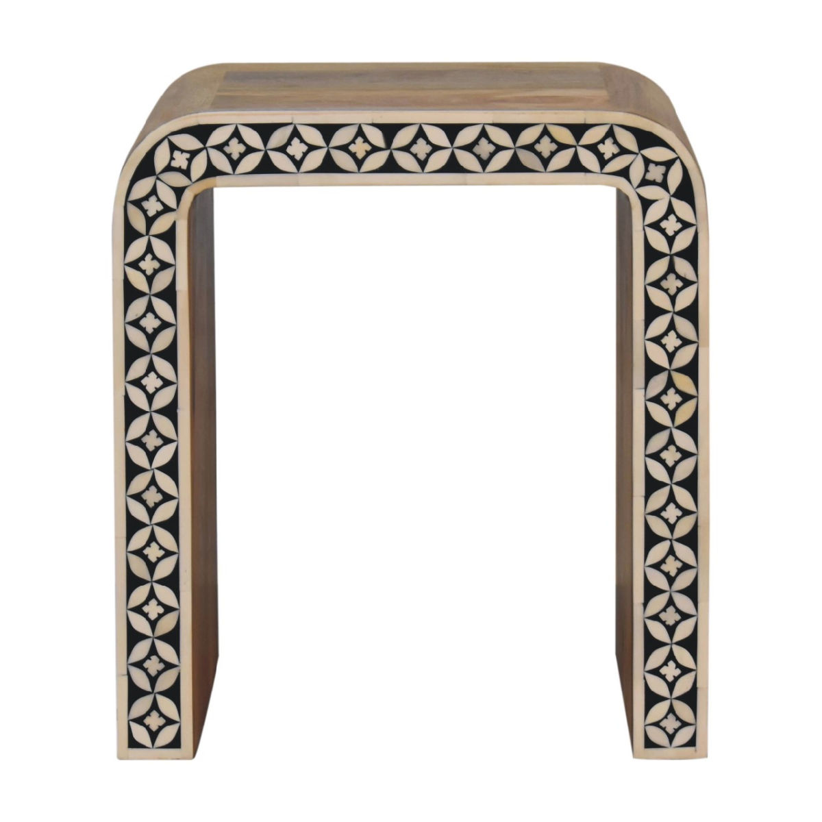 A sleek curved end table made of solid mango wood with black and cream bone inlay geometric edges