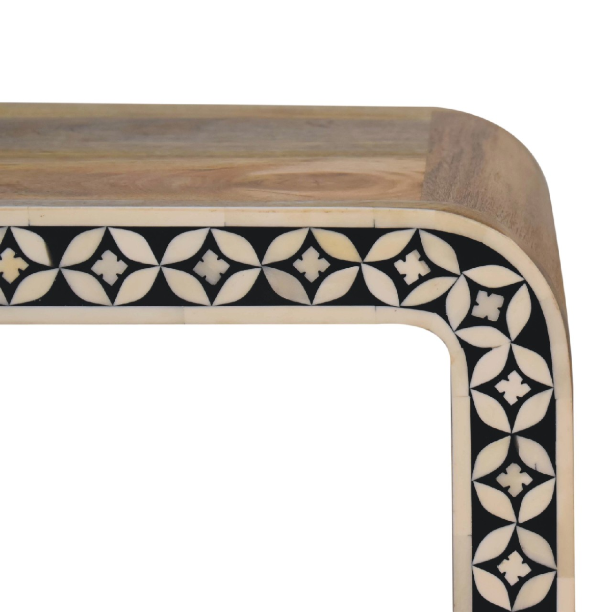A sleek wooden-framed mirror with black and cream geometric bone inlay on the curved edge of a solid mango wood end table