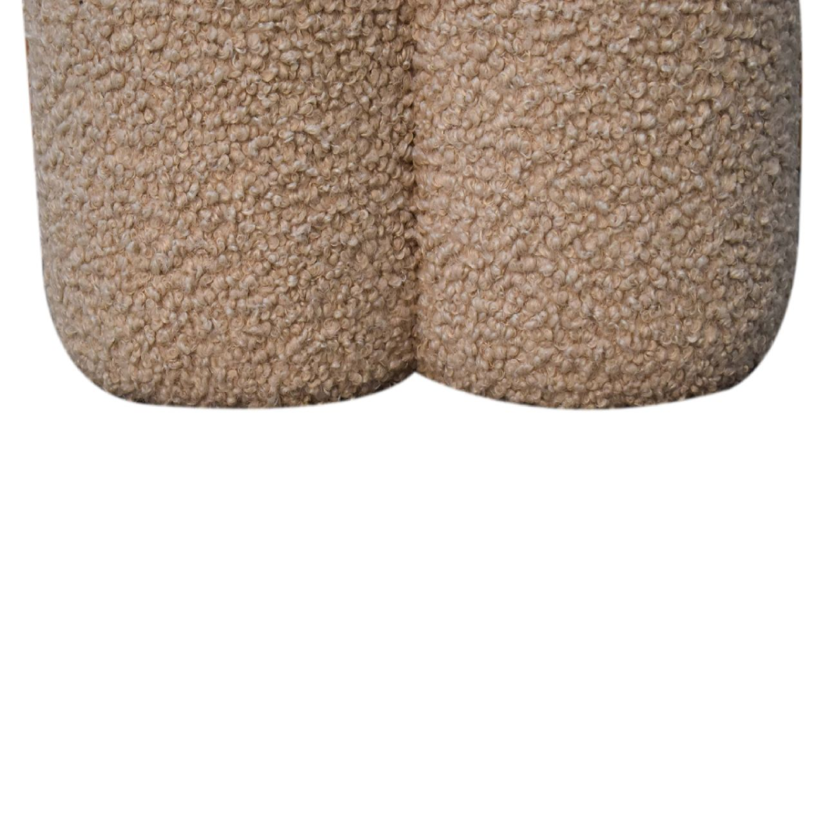 Beige faux fur shorts with a plush textured surface paired with artisan furniture solid mango wood mud boucle footstool