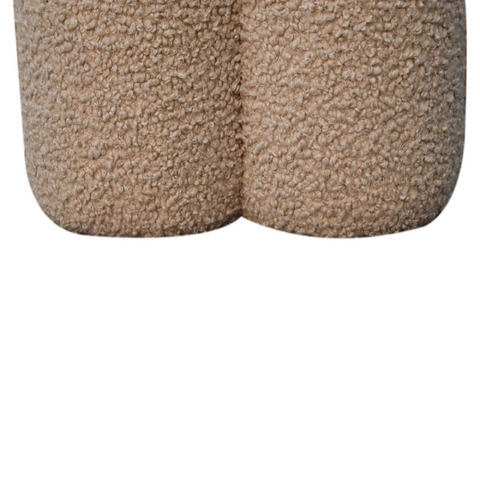 Beige faux fur shorts with a plush textured surface paired with artisan furniture solid mango wood mud boucle footstool