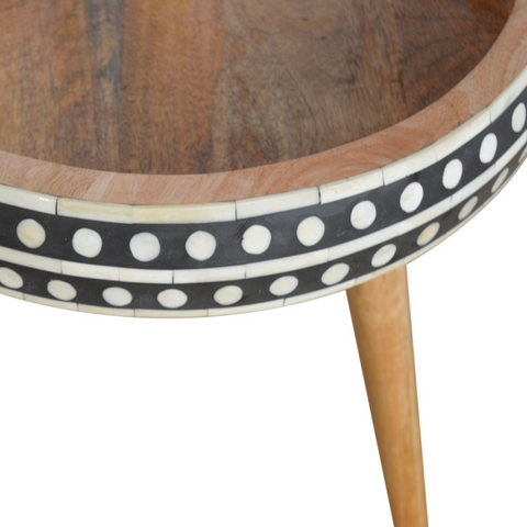 Artisan furniture solid mango wood round end table with black and white bone inlay pattern around the edge