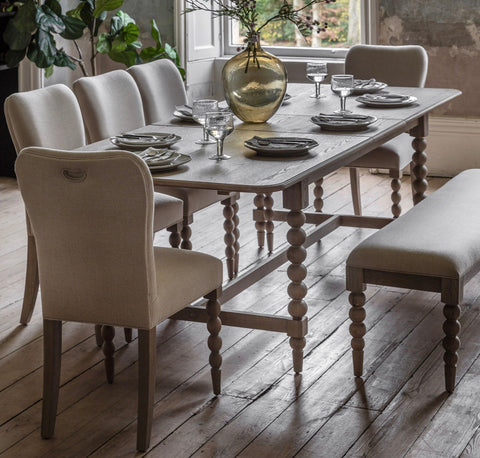Light gray wooden dining table with turned spindles and distressed finish artisan lime rectangle wash oak extending dining table