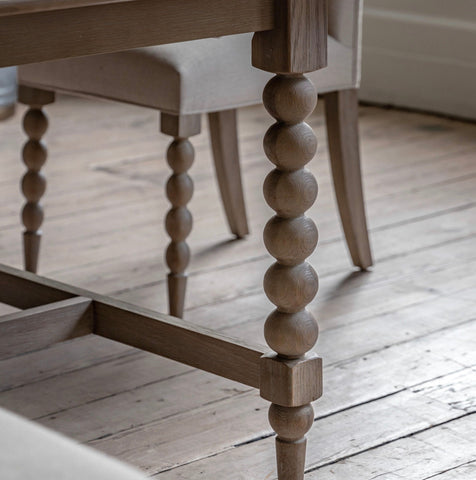 Artisan lime rectangle wash oak dining table leg in light gray with decorative bead detailing and rustic finish