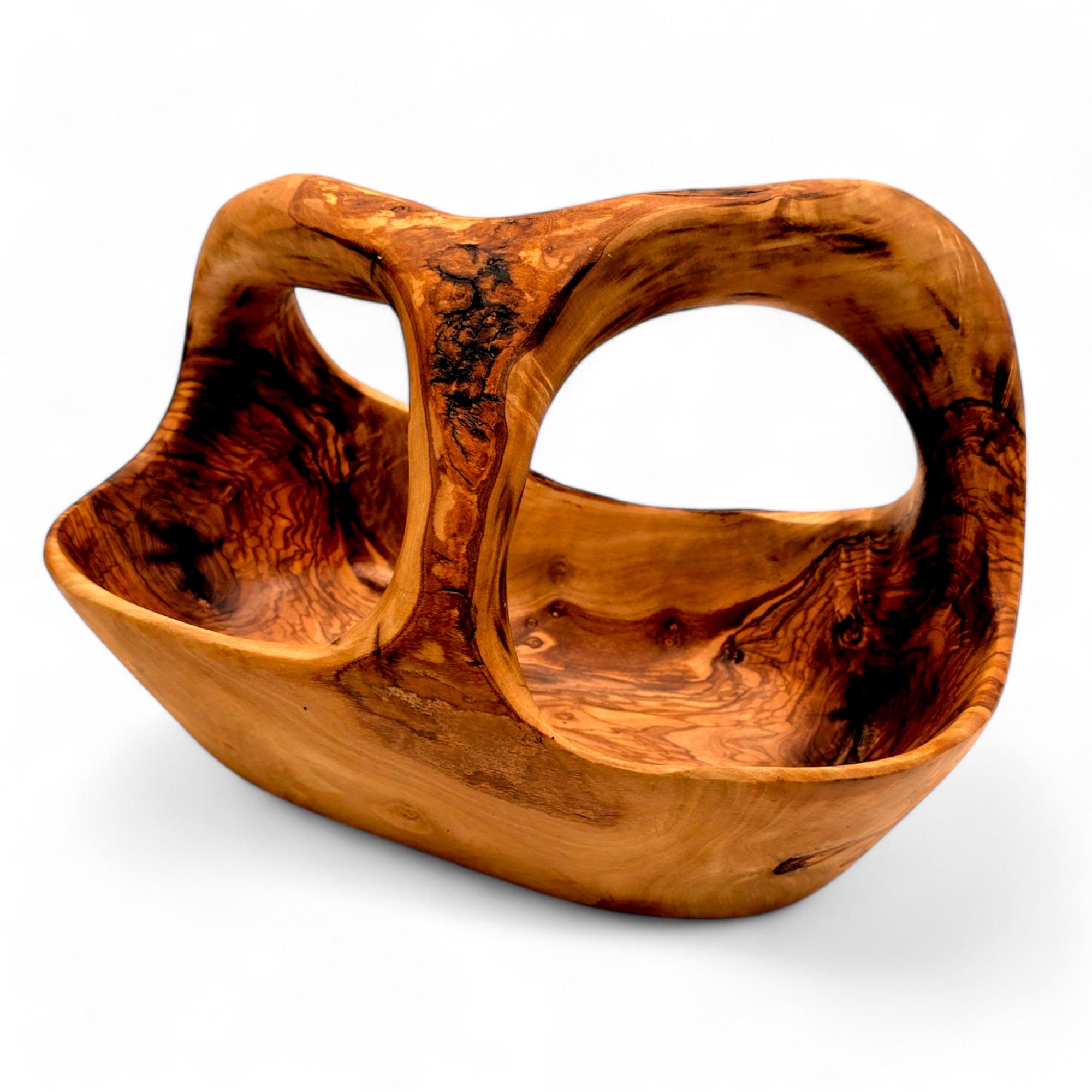 Handcrafted olive wood fruit basket with integrated handle featuring a warm amber finish and swirling grain patterns