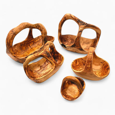 Handcrafted olive wood fruit basket with natural swirling grain patterns and rustic handles perfect for serving
