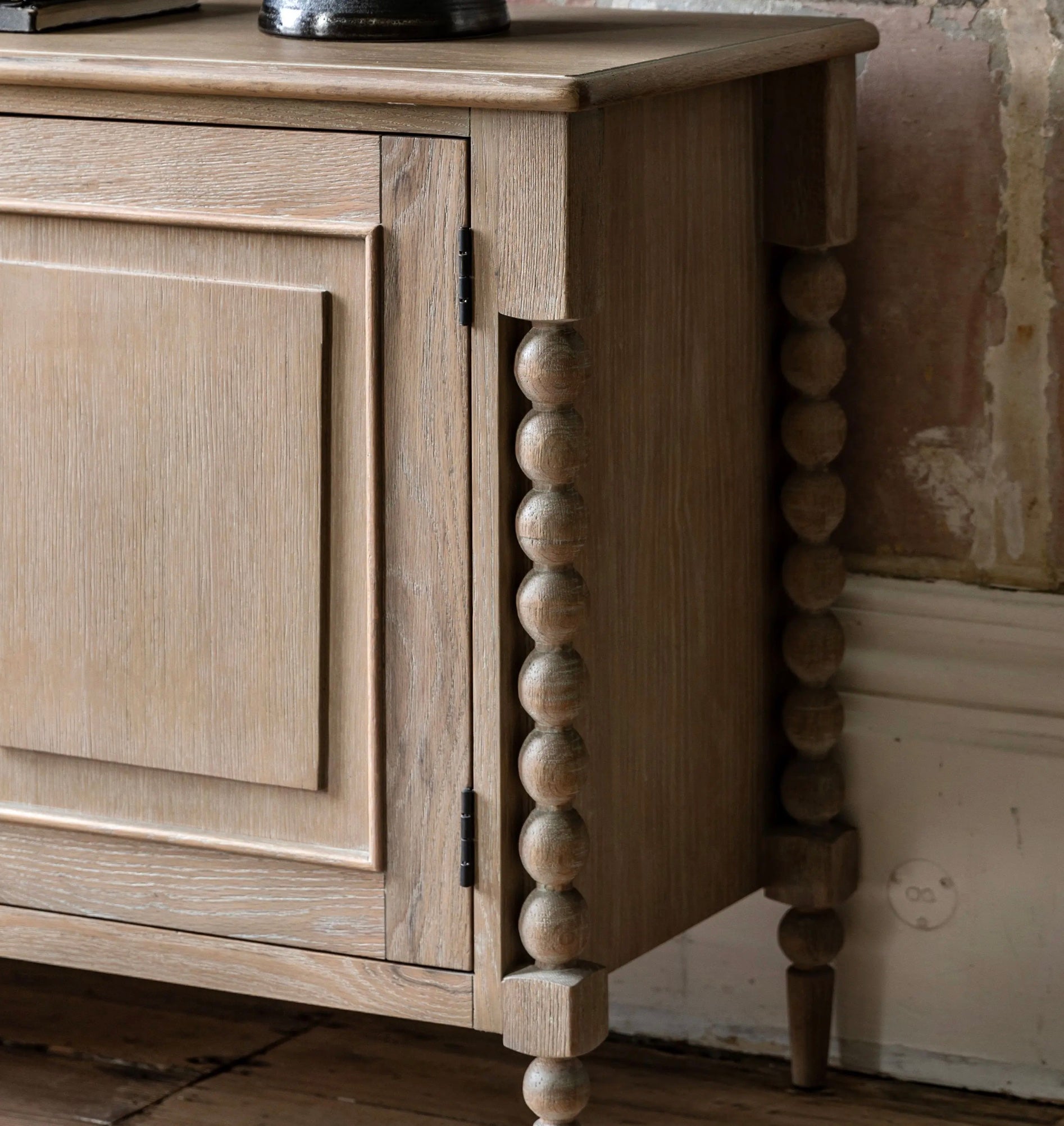 Light-colored oak artisan sideboard with bead-turned legs and paneled door w457 x d350 for stylish storage
