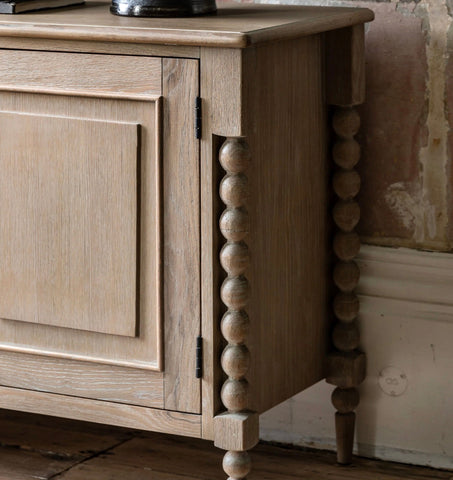 Light-colored oak artisan sideboard with bead-turned legs and paneled door w457 x d350 for stylish storage