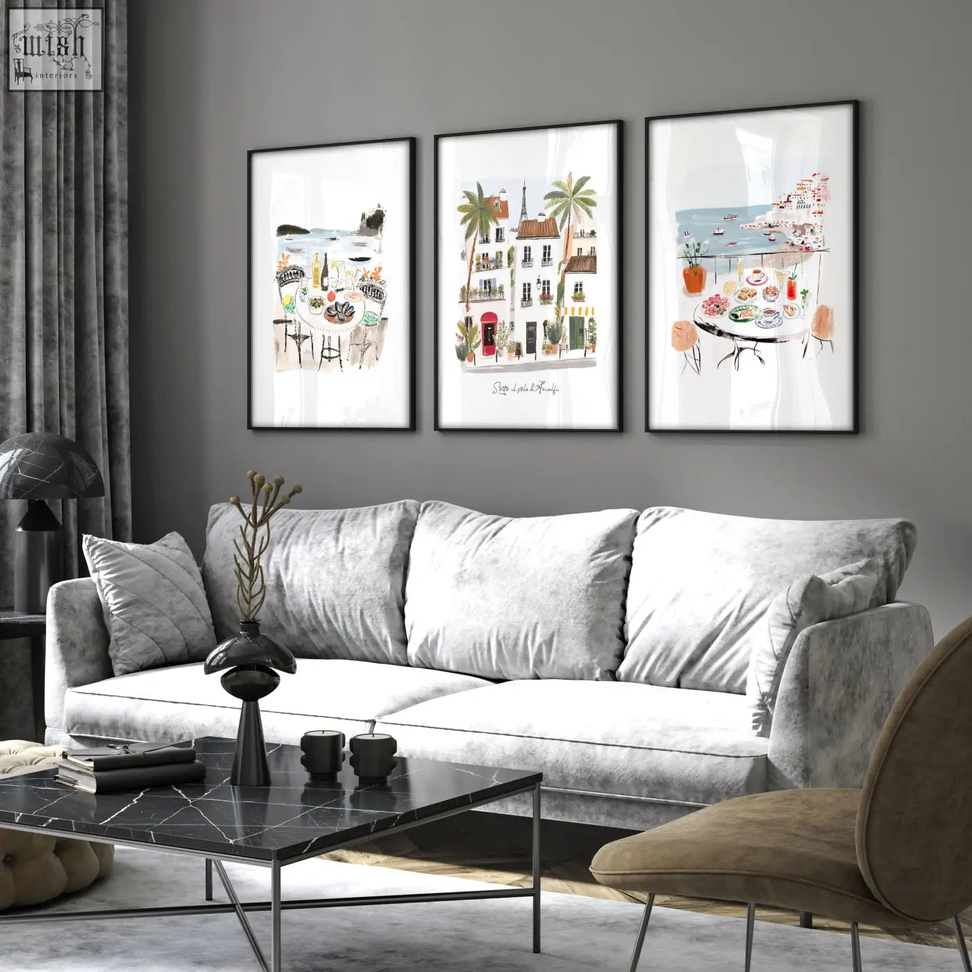 Gray velvet sofa with white cushions and black marble coffee table in living room featuring sotto il sole di amalfi artwork set