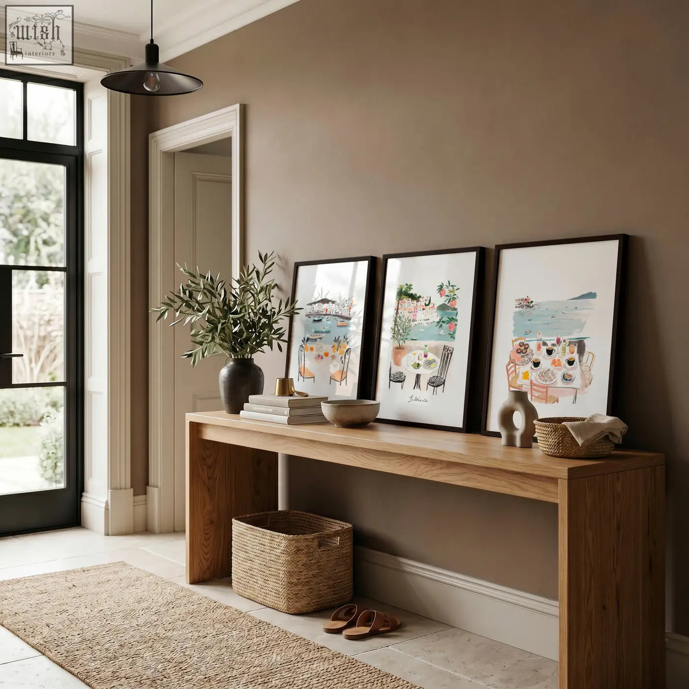 A sleek minimalist wooden console table with natural finish under three prints wall art prints for hallway decor