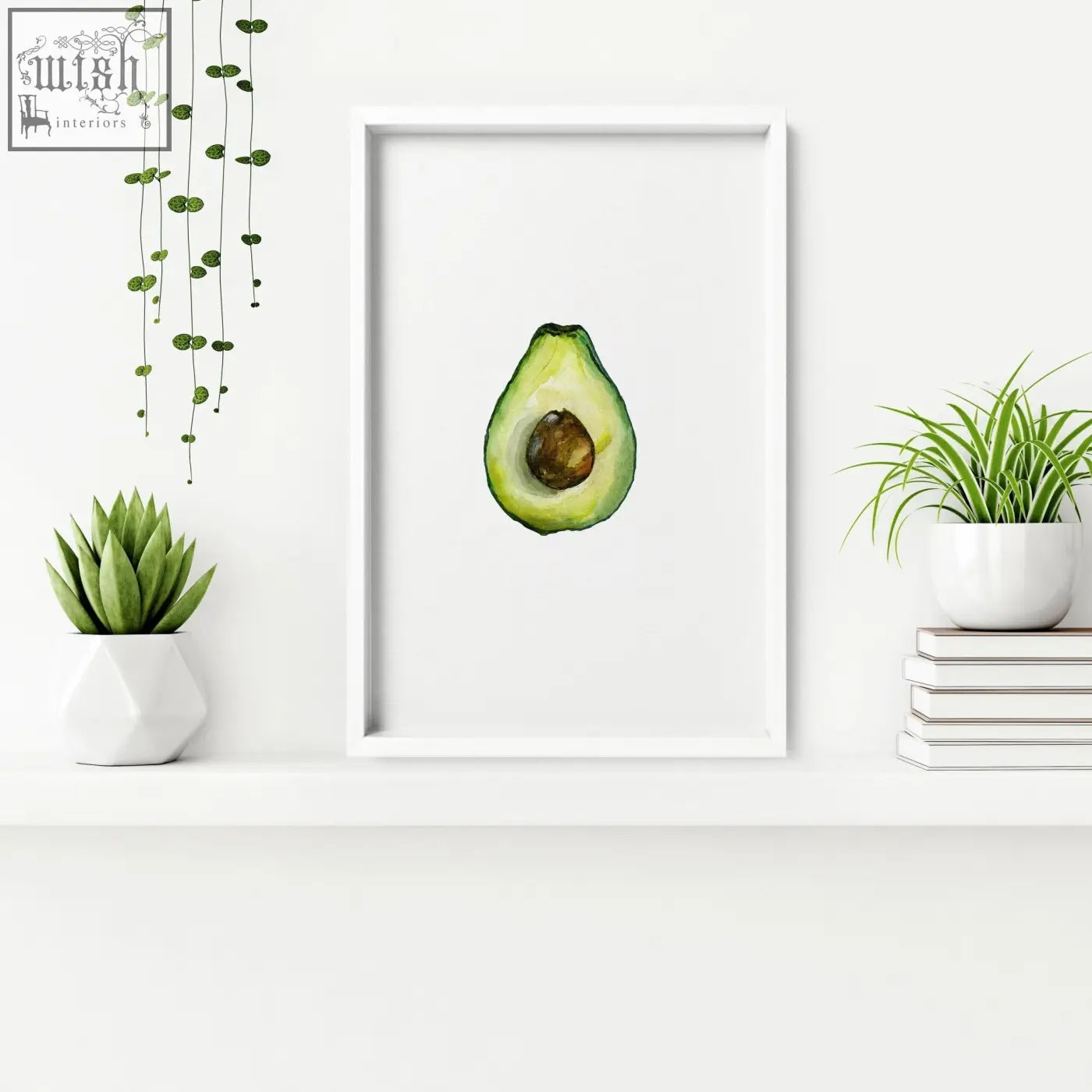 A watercolor avocado halved framed wall art in white perfect for kitchen decor and set of 3 wall art pieces