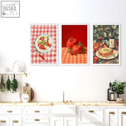 Three framed italian lifestyle wall art prints with vibrant reds and greens hang on a kitchen wall above a white counter
