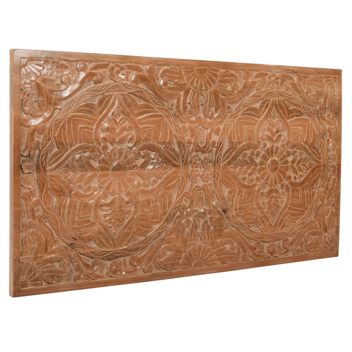 A light brown mango wood bedframe headboard with intricate carved floral and geometric patterns in a rectangular panel