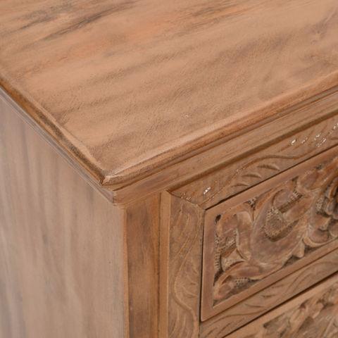 Hand carved artwork mango wood bedside table with intricate floral patterns and warm natural finish for storage