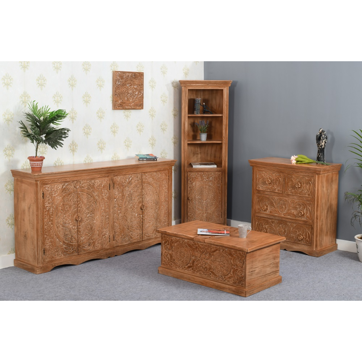 Hand carved light brown mango wood sideboard with ornate floral and scrollwork patterns on its doors