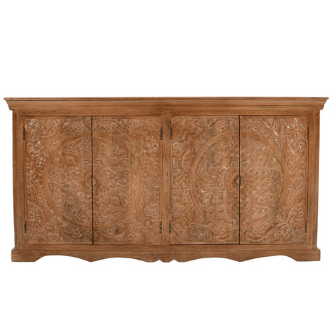 A rustic mango wood sideboard with four carved circular floral doors and a warm natural finish