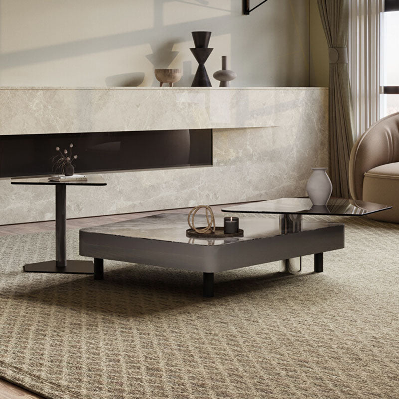 Modern rectangular arya nesting coffee table with sleek dark gray metal frame and reflective glass top in black