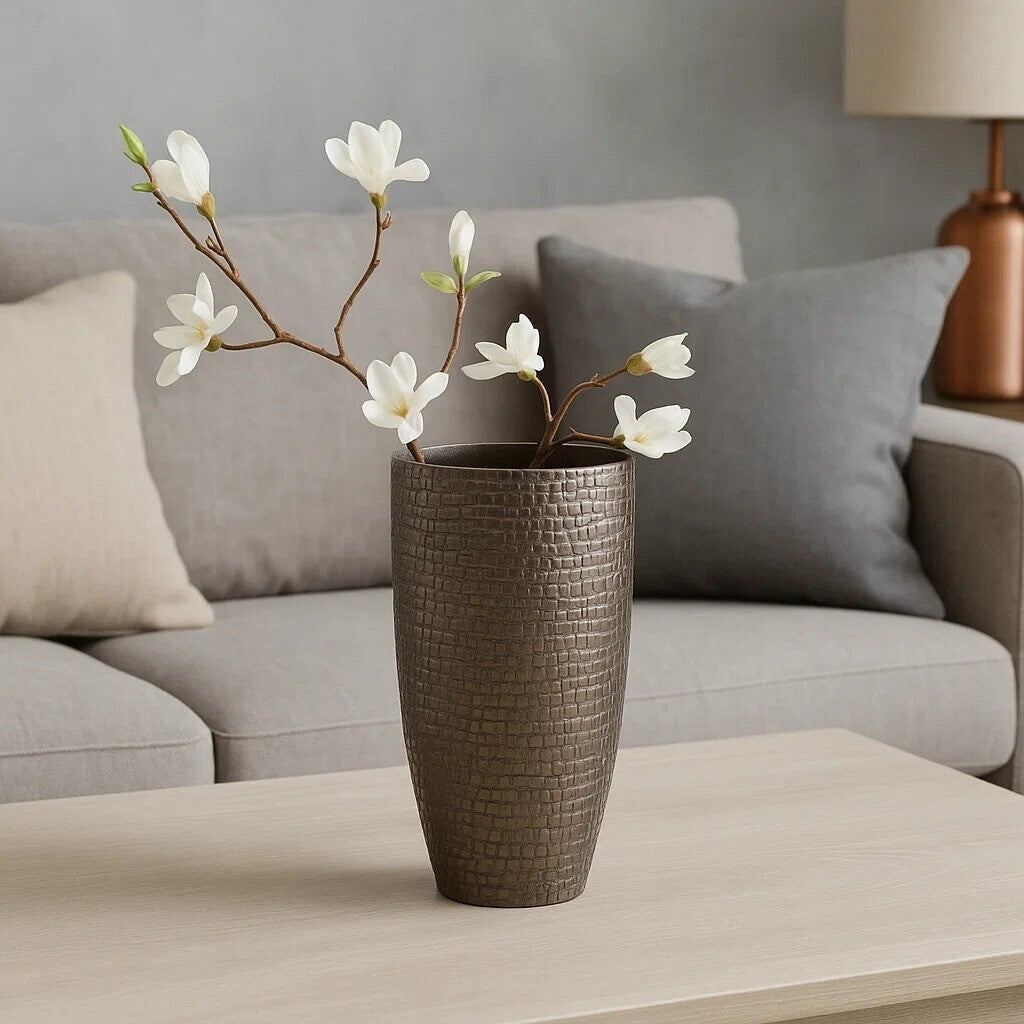 Arya pewter small pewter vase with a tall dark bronze textured brick pattern holding white magnolia branches