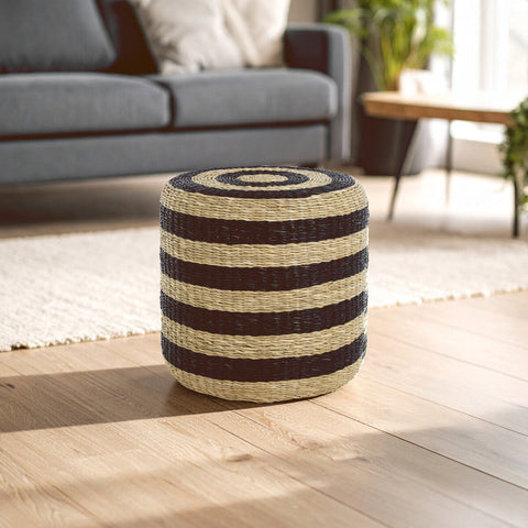 Ashby seagrass pouffe with black stripes made of tightly braided seagrass in dark brown and natural beige colors