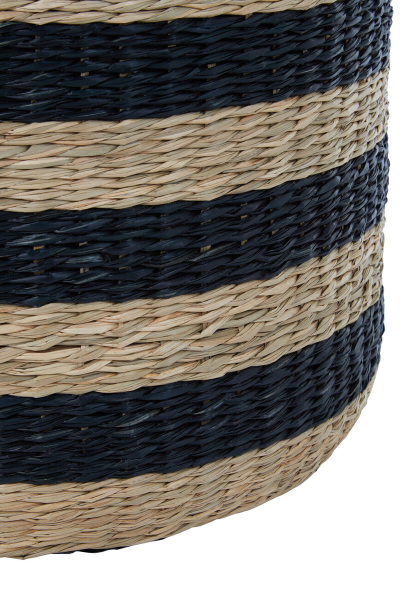 A cylindrical ashby seagrass pouffe with black stripes woven from natural beige and navy blue straw
