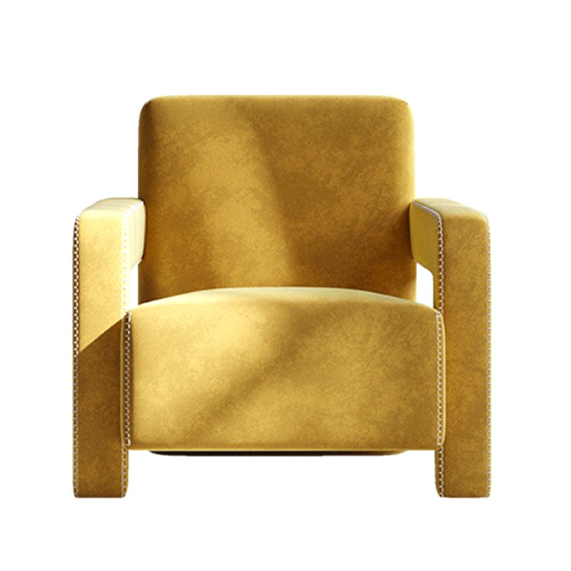 A plush mustard-yellow velvet aspasia armchair with classic cushions and subtle nailhead trim