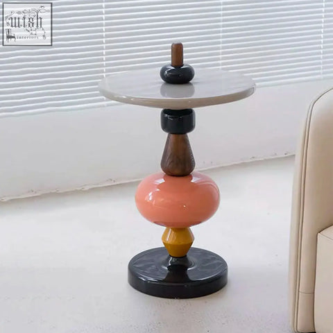 Aspasia side table with glossy white marble top and stacked black ceramic peach glass and ash wood material segments