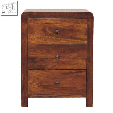 Rich brown wooden nightstand with three drawers and round metal knobs made from solid mango wood in chestnut finish