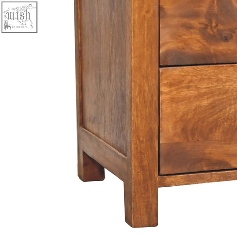 Warm-toned aspen bedside table in chestnut made from solid mango wood with visible grain and two drawers
