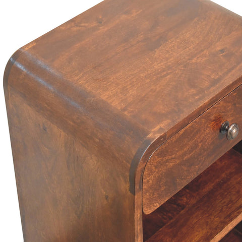 Rich brown mango wood bedside table with curved design and single drawer with metallic knob for bedroom use