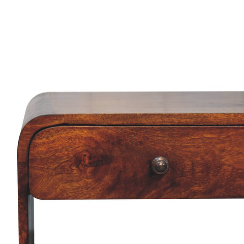 Aspen slim coffee table made of warm-toned wood with smooth finish and curved edges featuring a small drawer
