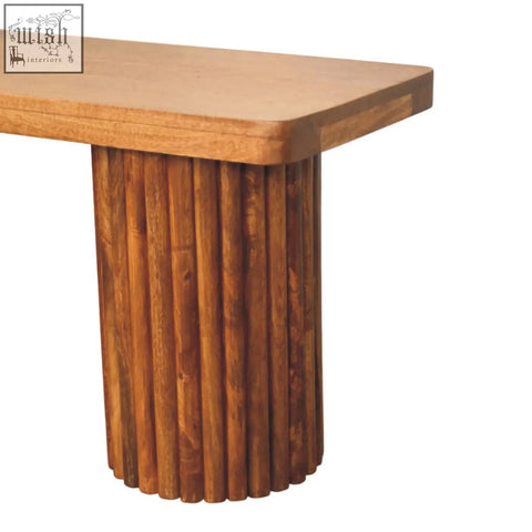 Astoria fluted bench with a smooth light brown top and dark natural mango wood log base in rustic style