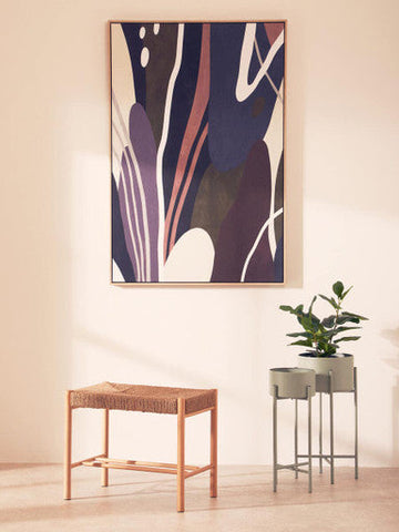 A modern astratto wall art with bold purple pink and white strokes framed in thin wooden border