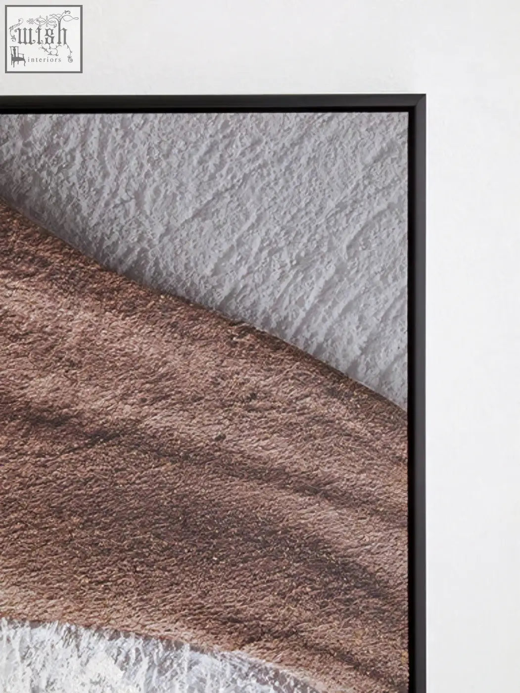 Black-framed wall art with earthy tones textured layers in muted brown and gray for modern decor