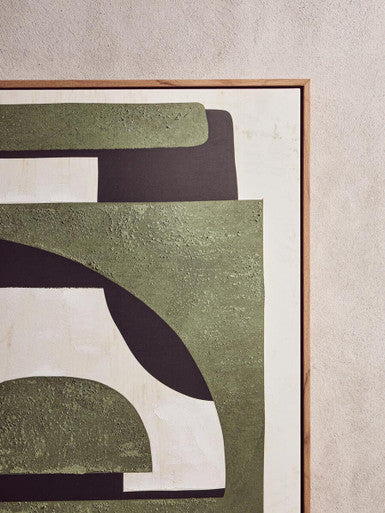 A modern abstract wall art with textured olive green black and white geometric shapes in a light wood frame