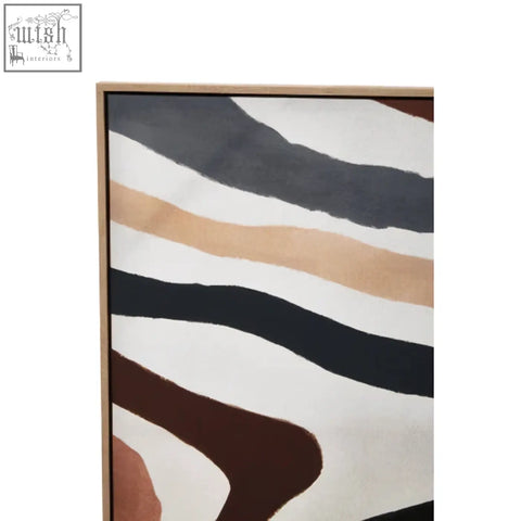 A framed multi coloured abstract wall art with bold wavy black beige and brown stripes on a white background