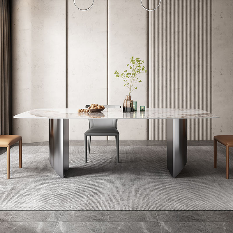 Astrid dining table with a sleek white sintered stone top and angular metallic legs modern dining table design