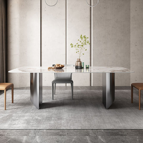 Astrid dining table with a sleek white sintered stone top and angular metallic legs modern dining table design