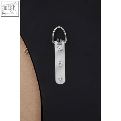Silver metal picture hanging hook with d-ring and screws on back of athena round wall mirror with silver finish