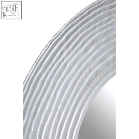 Athena round wall mirror with silver finish featuring a sleek curved frame and subtle horizontal ridges wall mirror