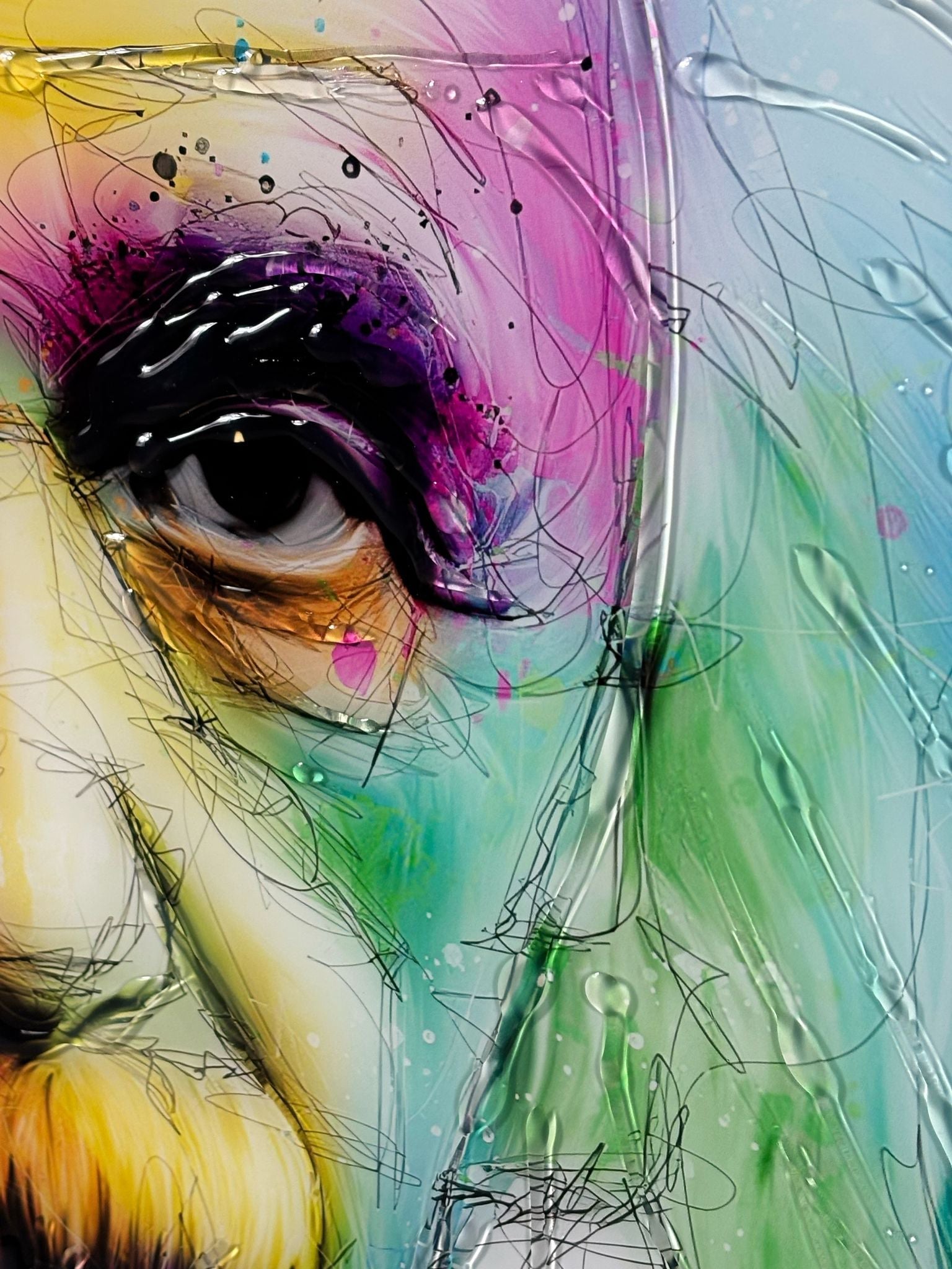 A vibrant abstract painting called atomic intellect featuring a close-up eye with bold black lashes and swirling colors