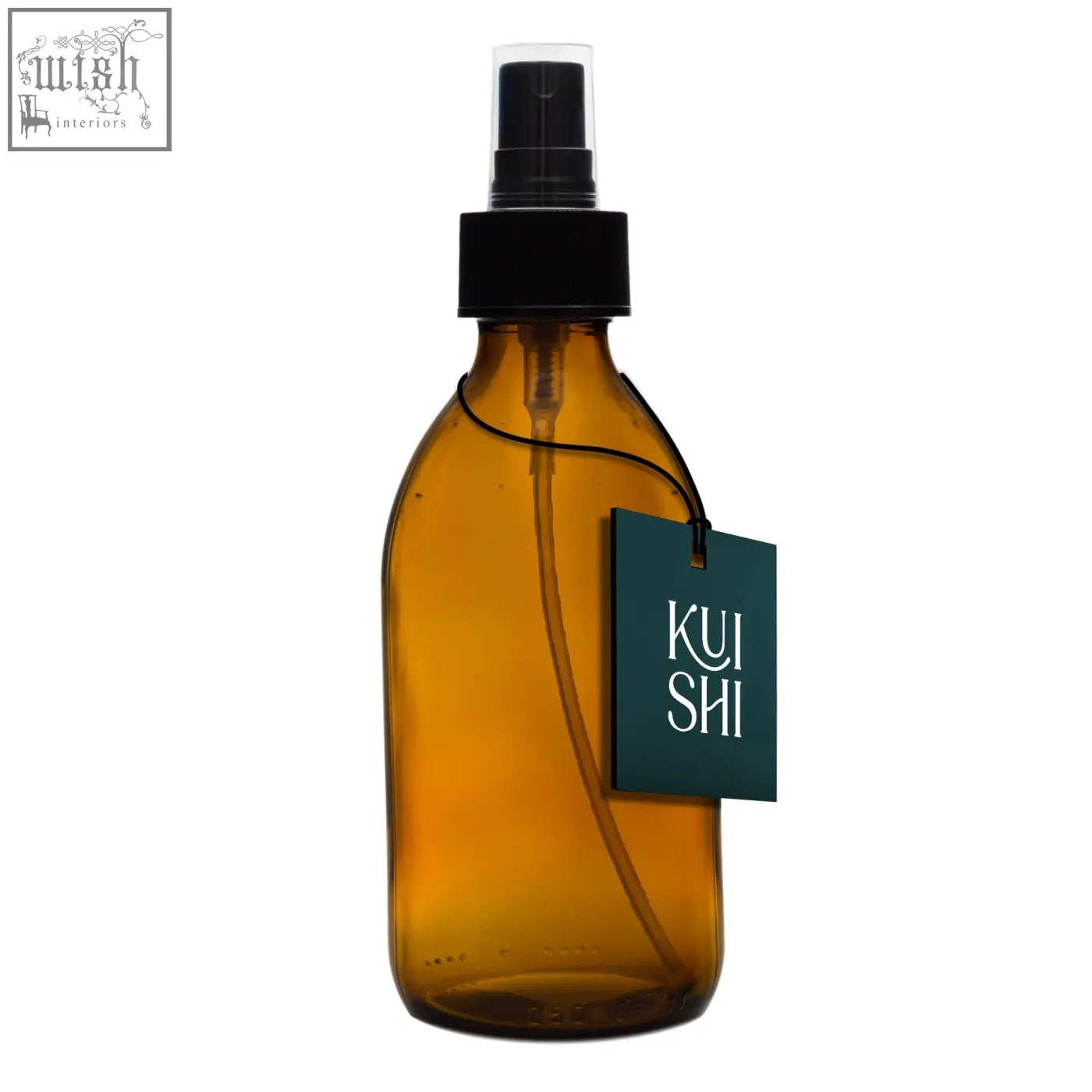 Amber glass spray bottle with black pump and dark green kui shi tag perfect to diffuse natural scents