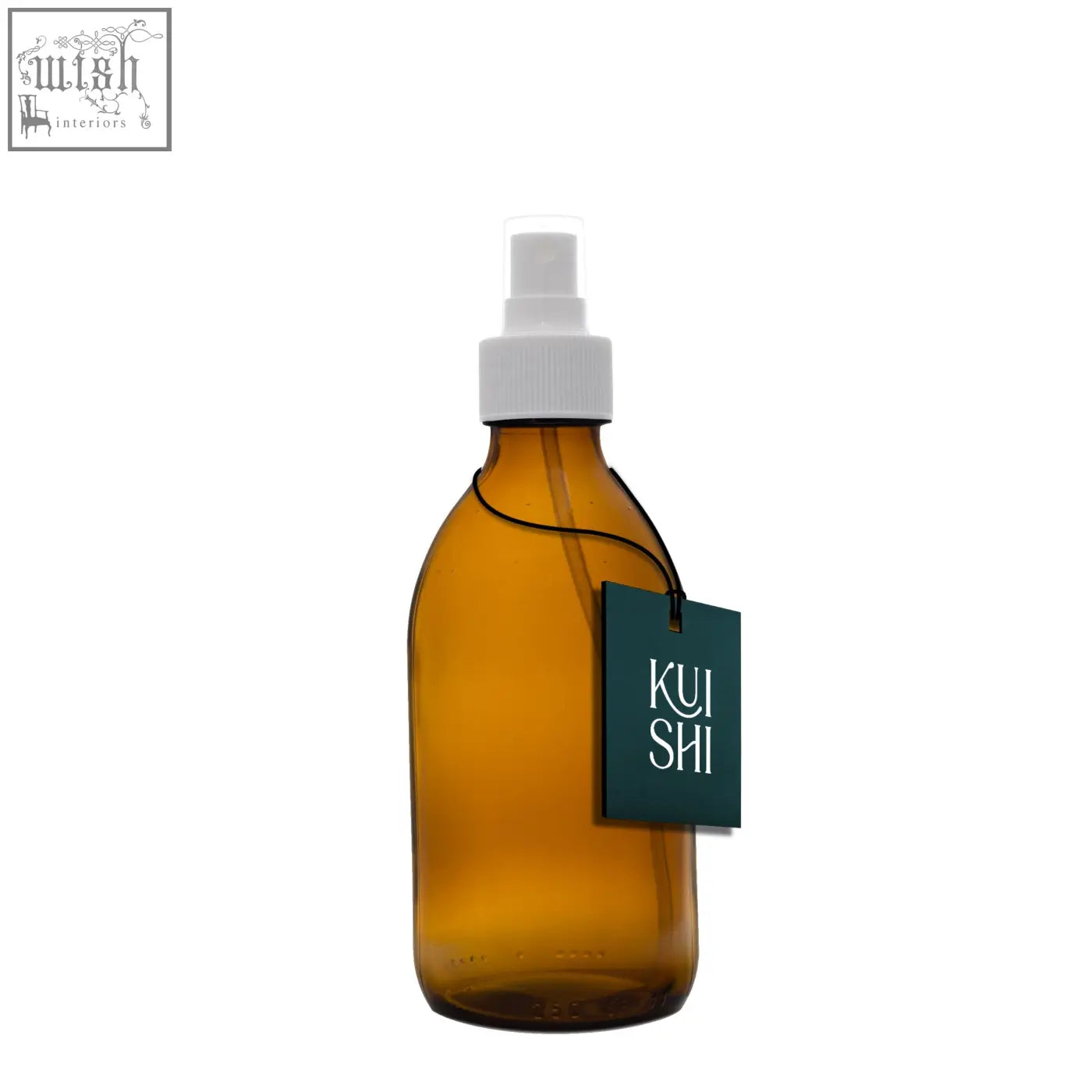 Amber glass atomiser spray bottle with white nozzle and dark green kui shi tag to diffuse natural scents