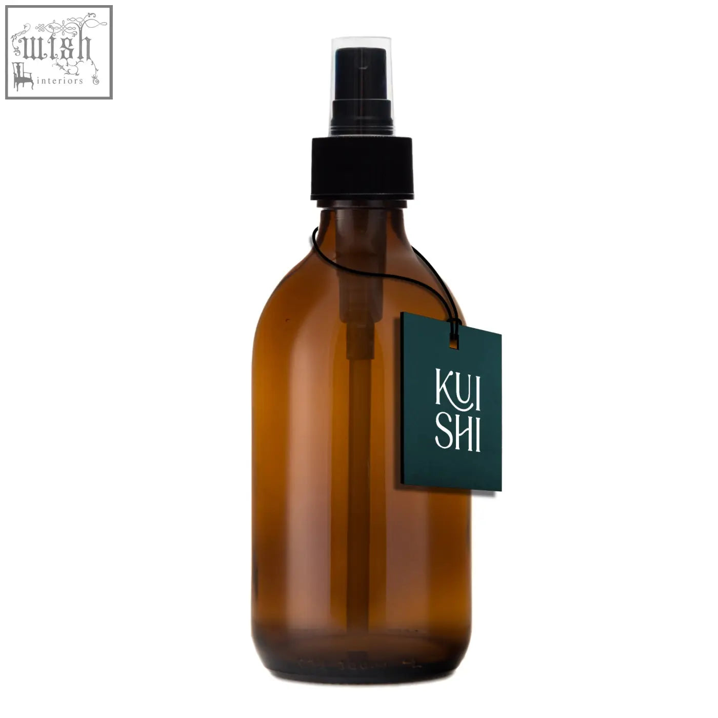 Amber glass spray bottle with black pump and dark green kui shi tag to diffuse natural scents easily