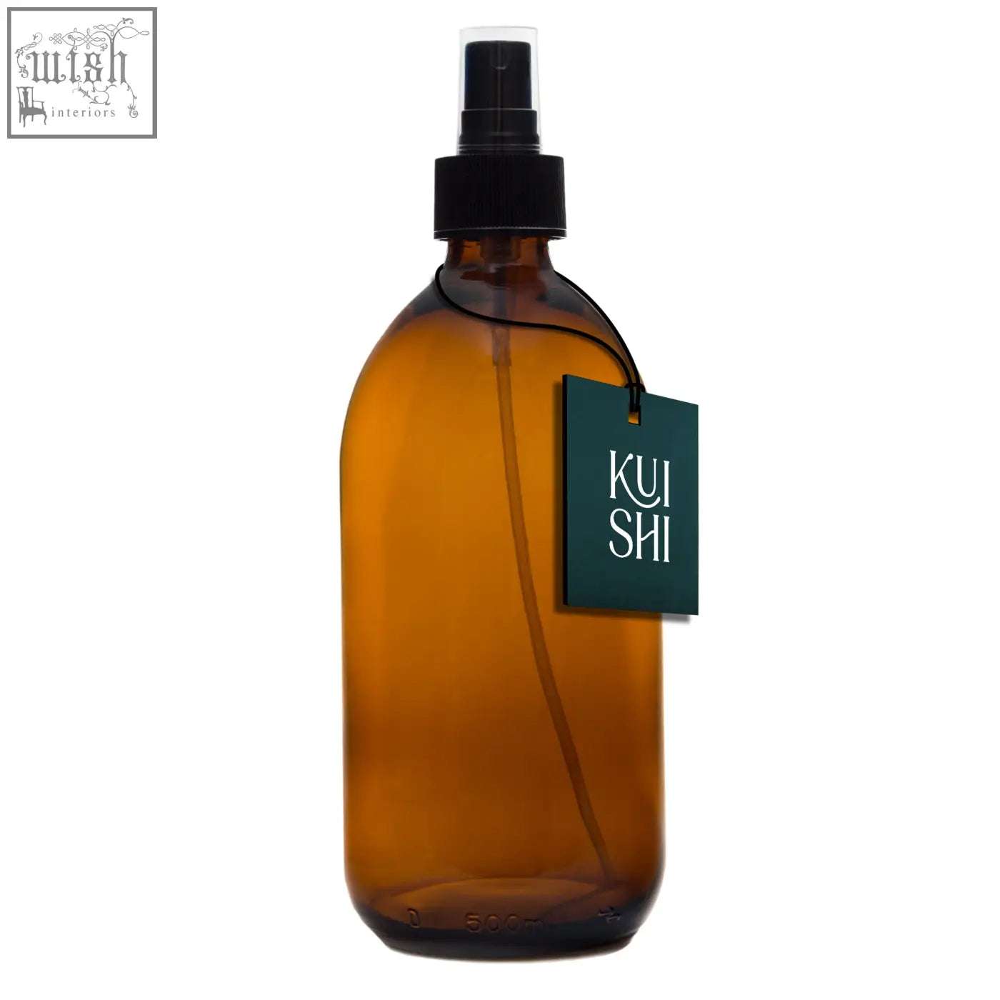Amber glass spray bottle with black pump and dark green kui shi tag designed to diffuse natural scents