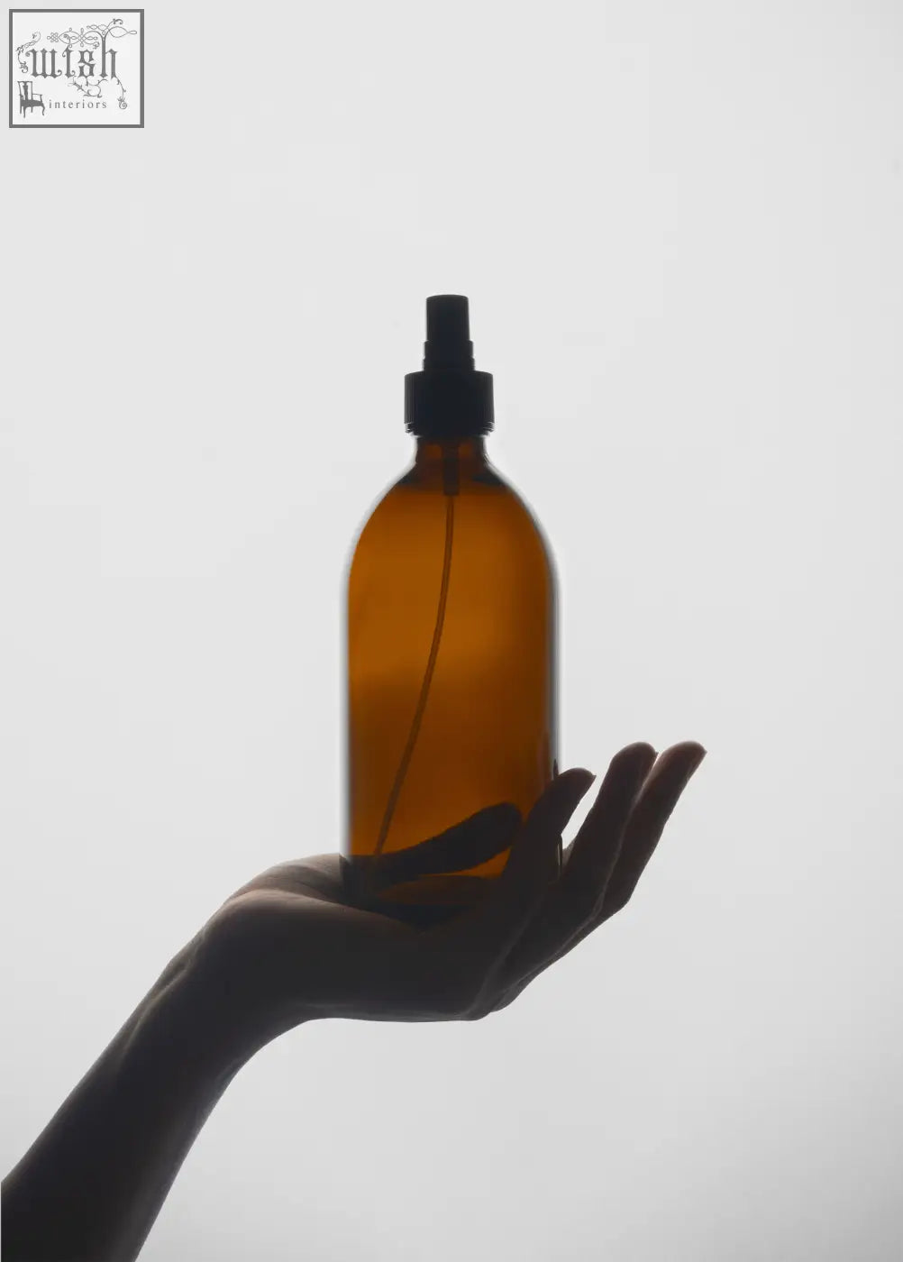 Amber glass spray bottle with black nozzle perfect for diffuse natural scents in a handy atomiser spray bottle design