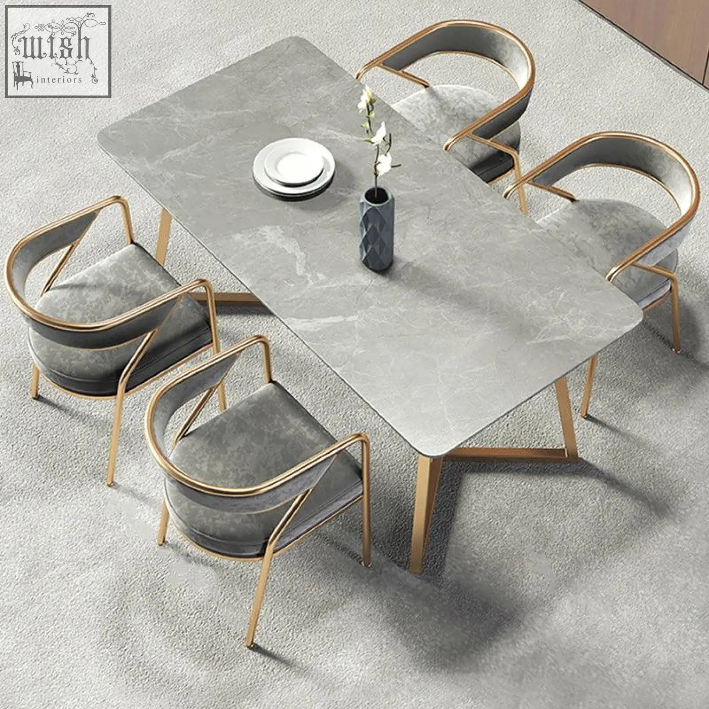 Modern gray marble dining table with gold-tone metal legs and matching attleboro dining chairs around it