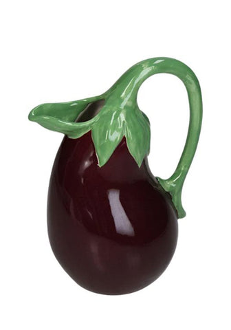 A glossy dark purple ceramic aubergine jug shaped like an eggplant with a green leafy stem handle
