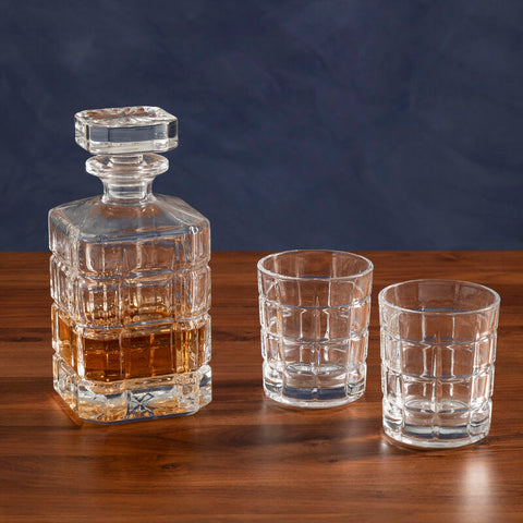Clear crystal Auclair decanter with faceted geometric design and matching square stopper with two tumblers