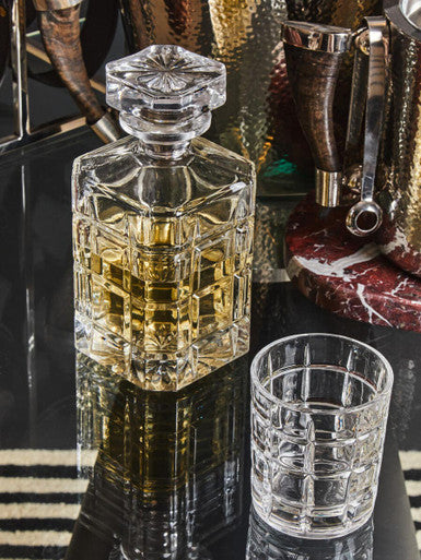 Auclair decanter with two tumblers featuring a faceted crystal geometric octagonal body and matching stopper