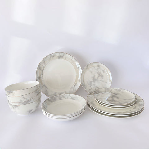 Aurelia 16-piece fine bone china dinner set with white ceramic, gray marble patterns, and subtle gold rim